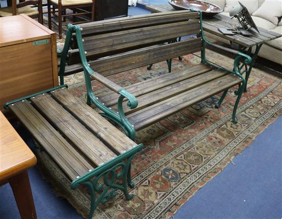 A pair of green painted cast iron and teak garden benches and two tables W.125cm table W.122cm and 76cm
